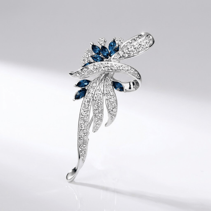 Elegant Sapphire Swirl Brooch
