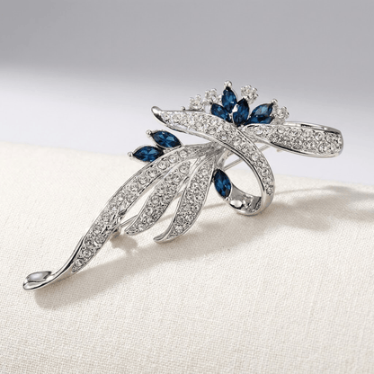 Elegant Sapphire Swirl Brooch