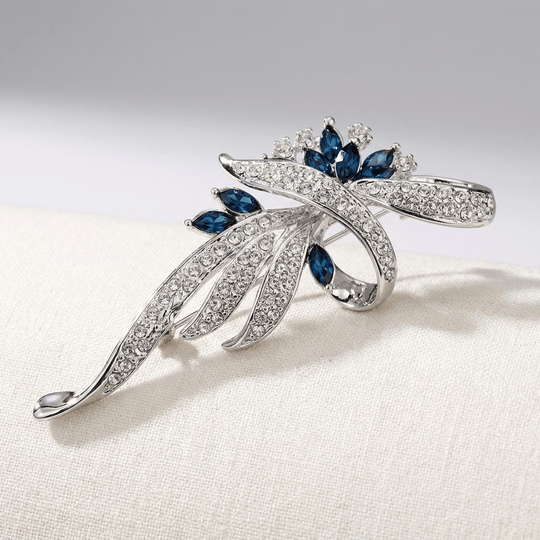 Elegant Sapphire Swirl Brooch